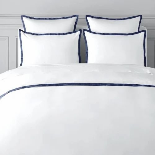 White hotel bedding in a modern bedroom