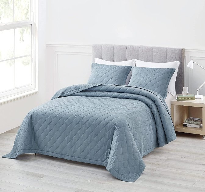 Dusty-blue diamond-quilted bedspread with shams