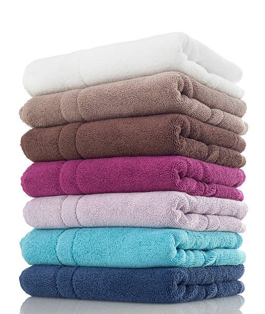 Stack of folded cotton towels in many colours